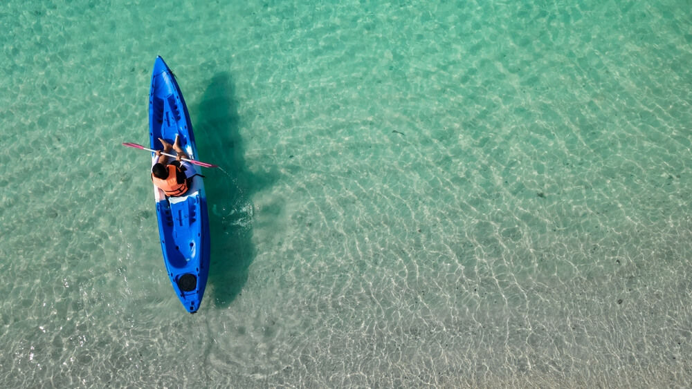 A person kayaking in Panama City beach waters.